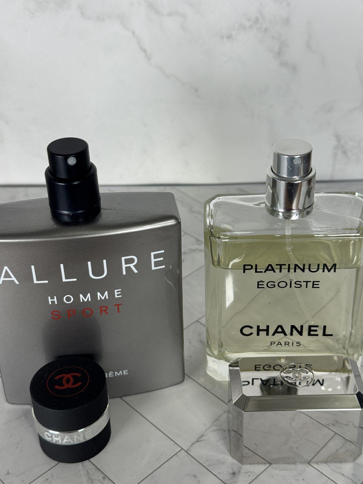 Full fragrance bottles next to their atomizers