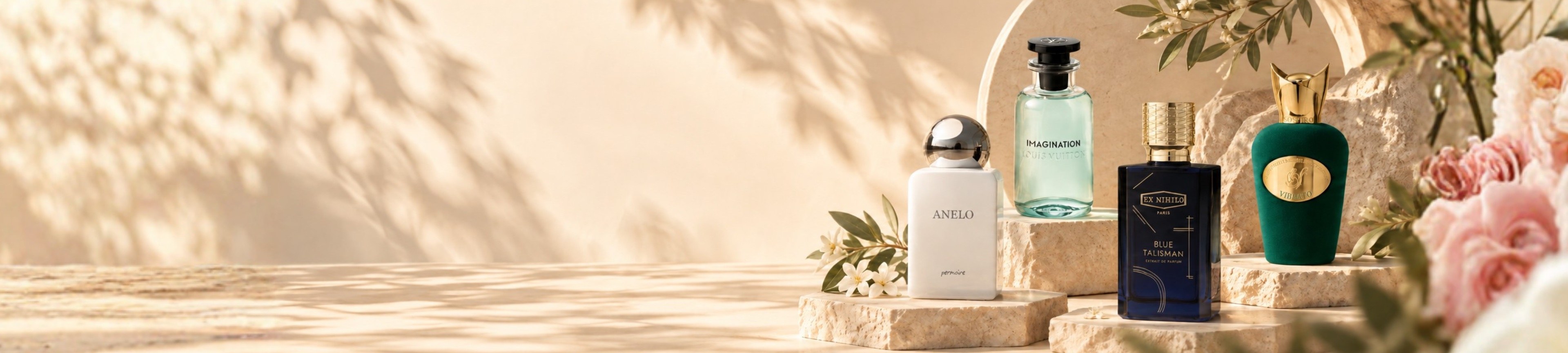 Niche fragrance bottles arranged on travertine plinths in warm daylight